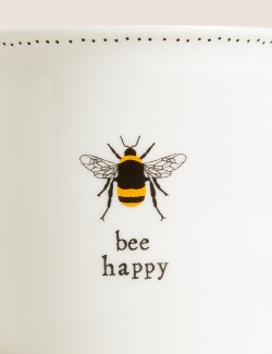 Hrnek s nápisem „Bee Happy“