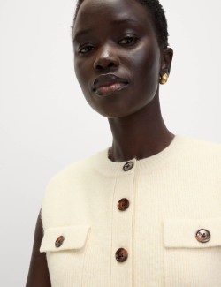 Pletený vestový kabát z mraky s kapsami a kulatým výstřihem