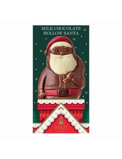 Dutá figurka z mléčné čokolády ozdobená bílou a hořkou čokoládou a červenou cukrářskou ozdobou