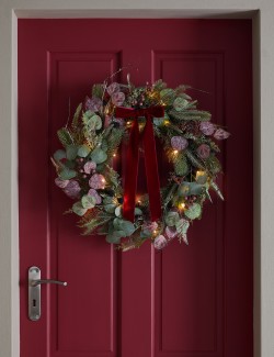 Věnec s mašlí z předem osvětleného ovoce