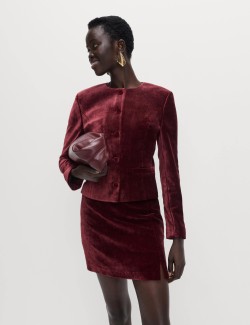 Sametová mini sukně áčkového střihu se strakatým vzorem a postranním rozparkem