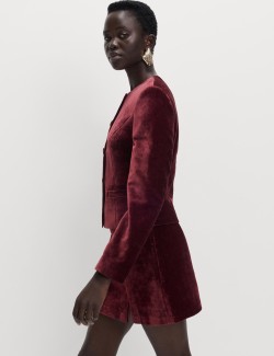 Sametová mini sukně áčkového střihu se strakatým vzorem a postranním rozparkem