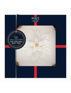 Ovocný máslový dort s rozinkami, brandy, glazovanými třešněmi, kousky mandlí, marcipánovou a cukrovou polevou ozdobený ozdobami 