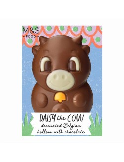 Dutá figurka z mléčné čokolády s ozdobou z hořké a bílé čokolády a oranžovou kakaovou ozdobou