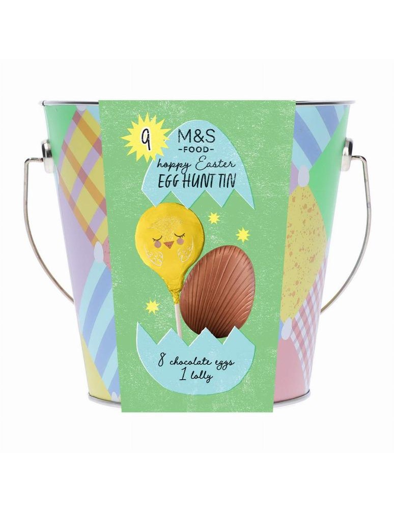 Jednotlivě balená dutá vajíčka z mléčné čokolády a balené lízátko z mléčné čokolády