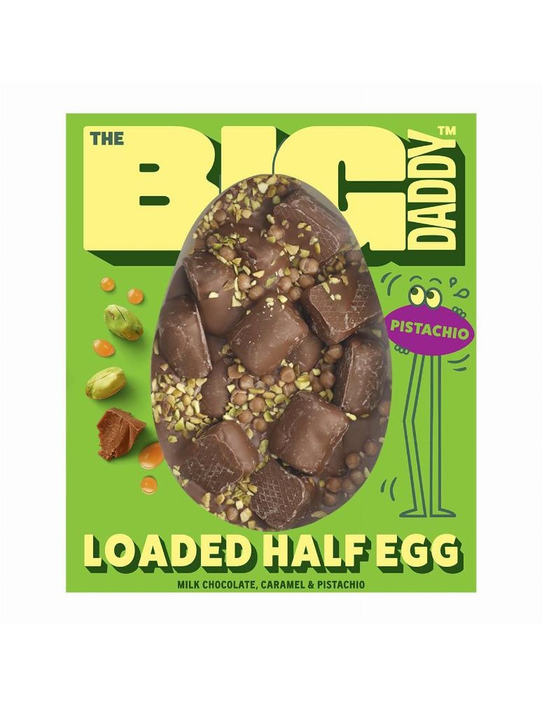 Půlené vajíčko z mléčné čokolády s formovanými kousky mléčné čokolády plněnými náplní z bílé čokolády a pistácií a vrstvou jemné