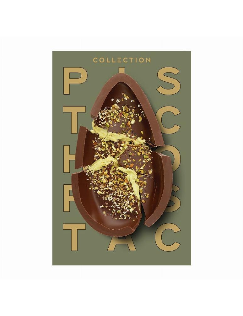 Zdobené třpytivé duté vajíčko z mléčné čokolády s pastou z pistáciových ořechů a vrstvou bílé čokolády, s posekanými praženými p