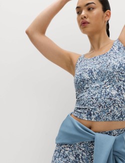 Zkrácená vesta Go Balance s pásky na zádech