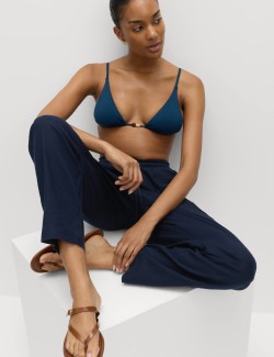 Mírně zúžené kalhoty s elastickým pasem s vysokým podílem lnu