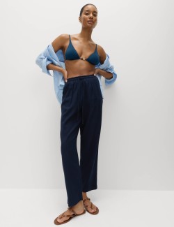 Mírně zúžené kalhoty s elastickým pasem s vysokým podílem lnu