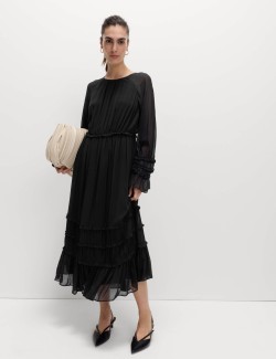 Průsvitné midi šaty se zvýrazněným pasem a volány